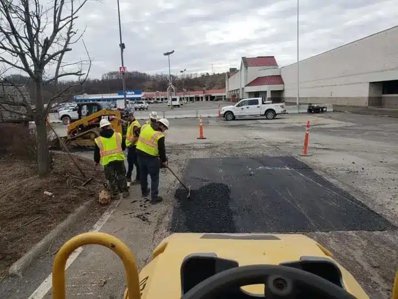 crew working on parking lot repairs