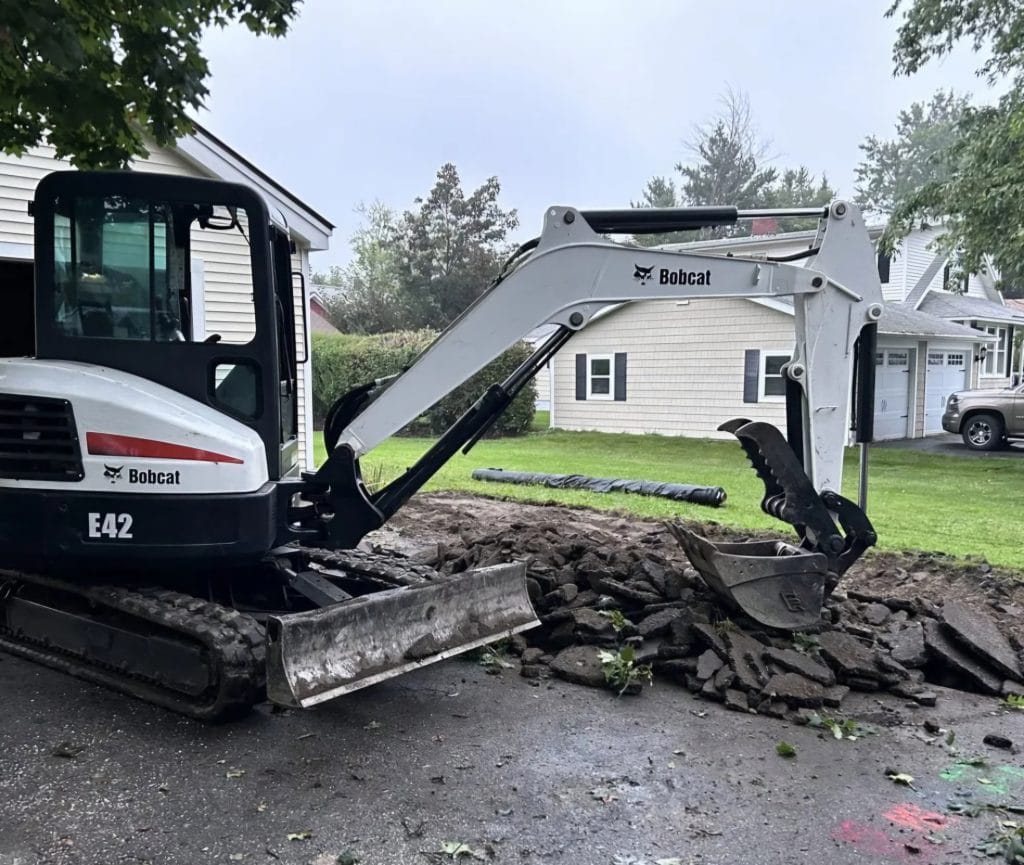 Bobcat removing asphalt for a new site development